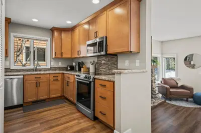 a kitchen with wooden cabinets and a stove top oven at 147 McCloud - The Perfect McCloud Getaway in Incline Village