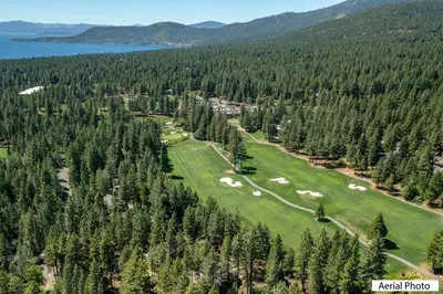 an aerial view of a golf course with trees at 168 Forest Pines - walk to Lakeshore Blvd community pool and hot tub in Incline Village