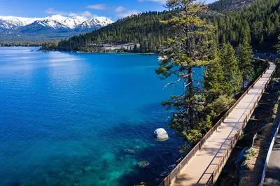an aerial view of a lake with trees and a dock at Mountain Shadows #172 - - pool in Incline Village