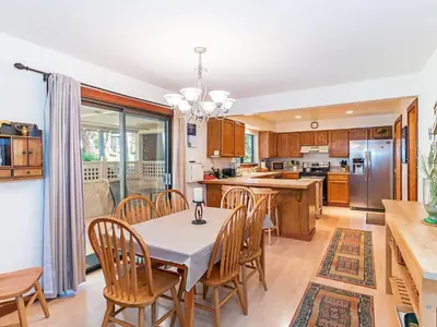 a kitchen and dining room with a table and chairs at A great mountain home offering amenities that makes for a great getaway in Lake Tahoe in Incline Village