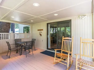 a screened porch with a table and chairs on it at A great mountain home offering amenities that makes for a great getaway in Lake Tahoe in Incline Village