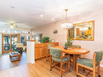 a kitchen and dining room with a table and chairs at The McCloud Condominium complex is one of the most popular vacation rentals in Incline Village