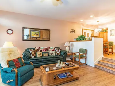 a living room with a couch and a table at The McCloud Condominium complex is one of the most popular vacation rentals in Incline Village