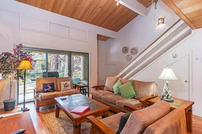 a living room with a couch and a table at Forest Pines Condo #216 in Incline Village