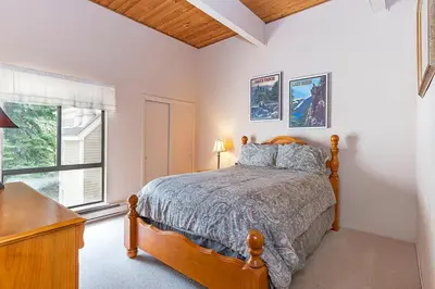 a bedroom with a bed and a window at Forest Pines Condo #216 in Incline Village