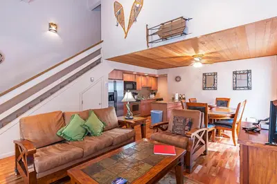a living room with a couch and a table at Forest Pines Condo #216 in Incline Village