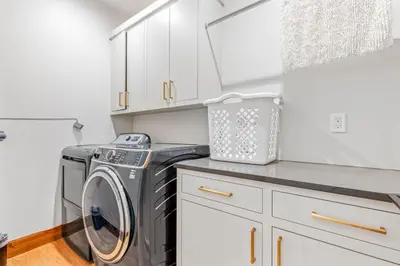 a laundry room with a washer and dryer at Harmony at Tahoe Donner - Ultra Modern 4 BR, Hot Tub, Game Room, Amenity Access in Truckee