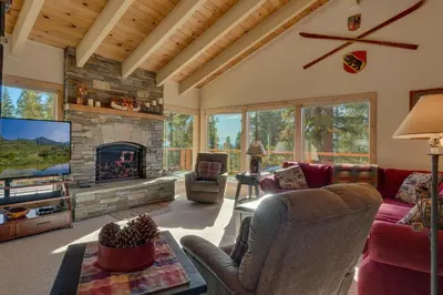 a living room with a fireplace and a tv at Lake Haven at Dollar Point - Spacious 4 BR w Lake Views, Sauna, Near Ski Resorts! in Tahoe City