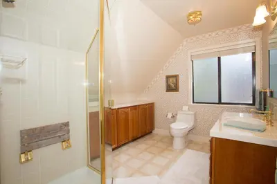 a bathroom with a shower and a toilet and a sink at Lakeside Escape - Beautiful Lakefront, Pier, Wood Fireplace, Private Hot Tub in Tahoe Vista