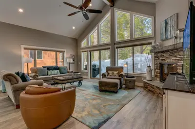 a living room with a couch and a fireplace at Mountain Jewel in Tahoe Donner - Beautiful 4 Bedroom w Hot tub, Access to HOA Amenities in Truckee