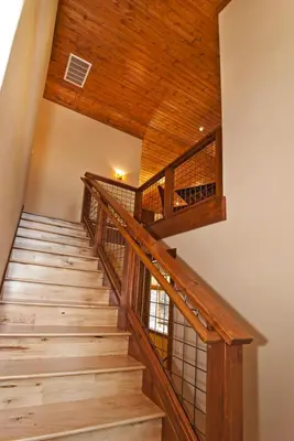 a wooden staircase in a house with a wooden ceiling at Rooney Ridge - Luxury 2600 Sq Ft, Cozy Fireplace, Family Room, Ping Pong Table! in Carnelian Bay