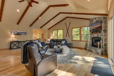 a living room with a couch and a fireplace at Paradise in the Pines - Luxury Home in Quite Neighborhood, Wooded Views, Short Drive to Skiing in Carnelian Bay