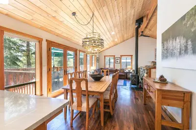 a dining room with a table and chairs at Shady Pines at Tahoe Donner- Serene Forest Retreat, 2 Gas Fireplaces, Sauna in Truckee