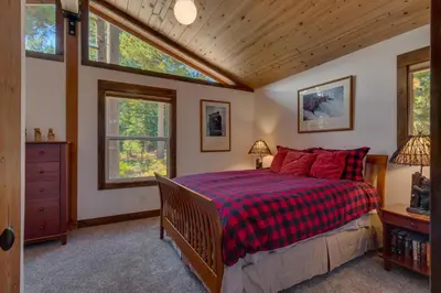 a bedroom with a bed and two windows at Silver Tip at Tahoe Park w HOA amenities - 3BR Pet Friendly, Hot Tub, Tahoe City in Tahoe City