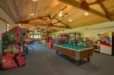 a room with a pool table and arcade games at Silver Strike #2- Walk to Village- Ski Shuttle to Lifts in Truckee