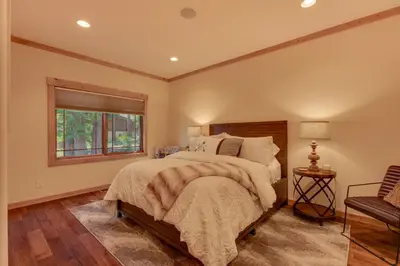 a bedroom with a large bed and a window at Starlight Retreat at Gray's Crossing in Truckee
