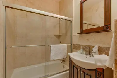 a bathroom with a shower and a sink and a mirror at Starlight Retreat at Gray's Crossing in Truckee