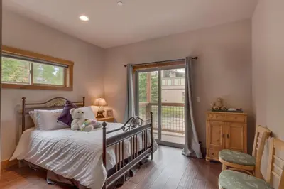 a bedroom with a bed with a teddy bear on it at Skyland Jewel at Dollar Point - Luxury 3BR - Easy Winter Access in Tahoe City