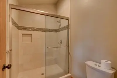 a bathroom with a glass shower with a toilet at Skyland Jewel at Dollar Point - Luxury 3BR - Easy Winter Access in Tahoe City