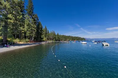 a large body of water with boats in it at Tahoe Woods by Tahoe Getaways - Pet Friendly Tahoe Park Cabin w Hot Tub, Fireplace, Near Skiing! in Tahoe City