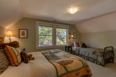 a bedroom with two beds and a window at Vanni House - Classic Tahoe Style 2 BR - Sleeps 6 - Hot Tub - Near Palisades & Downtown Tahoe City in Tahoe City