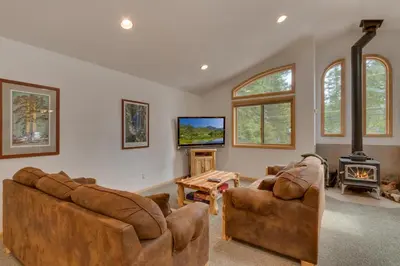 a living room with two couches and a tv at Tahoma Charm on West Shore - Beautiful Open Concept 3 BR w Private Hot Tub in Tahoma