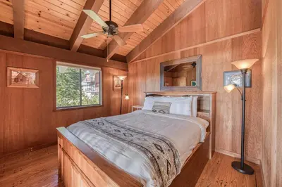a bedroom with a bed and a ceiling fan at View at Dollar Point - Beautiful Lake Views with Sunny Deck, Quiet Neighborhood, Near Skiing in Tahoe City
