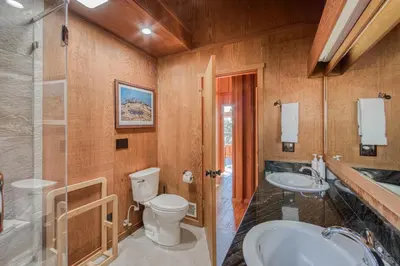 a bathroom with two sinks and a toilet and a shower at View at Dollar Point - Beautiful Lake Views with Sunny Deck, Quiet Neighborhood, Near Skiing in Tahoe City