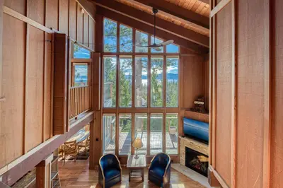 a room with chairs and a large window at View at Dollar Point - Beautiful Lake Views with Sunny Deck, Quiet Neighborhood, Near Skiing in Tahoe City