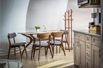 a kitchen with a wooden table and chairs at Sequoia Studio Suites in Three Rivers