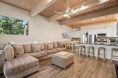 a large living room with a couch and a kitchen at The perfect Forest Pines getaway in Incline Village
