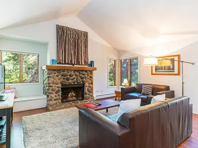 a living room with a couch and a fireplace at 252 McCloud Upper level unit in Incline Village