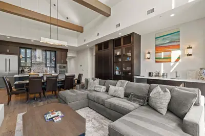 a living room with a couch and a dining room at Appreciate this exclusive private penthouse located on Lake Tahoe in Crystal Bay