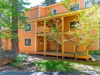 an orange house with a tree in front of it at 39 McCloud Incline Village in Incline Village