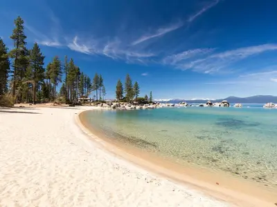 a view of a beach with trees and the water at Incline Village Championship Golf Coarse Retreat in Incline Village