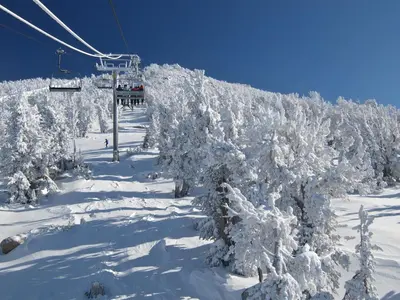 a ski lift with snow covered trees on a ski slope at Incline Village Championship Golf Coarse Retreat in Incline Village