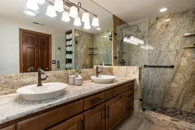 a bathroom with two sinks and a shower at Fabulous Views Of Lake Tahoe in Crystal Bay