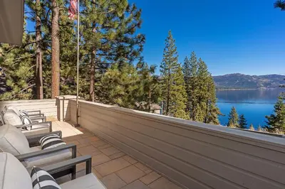 a patio with chairs and a view of a lake at Fabulous Views Of Lake Tahoe in Crystal Bay