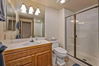 a bathroom with a toilet and a sink and a shower at 5 McCloud - Bright and Quaint Living in Incline Village