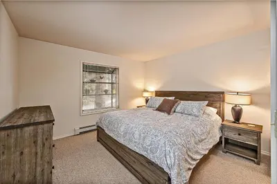 a bedroom with a bed and a window at 5 McCloud - Bright and Quaint Living in Incline Village