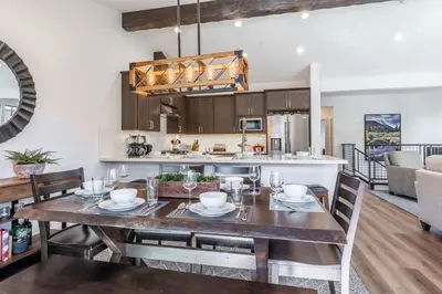 a dining room and kitchen with a table and chairs at Creekhouse 1380 in Mammoth Lakes