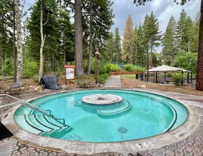 a small pool with a fountain in the middle at Rocky Point #93 3BR Townhome in Northstar - Shuttle to Slopes - HOA Amenities in Truckee
