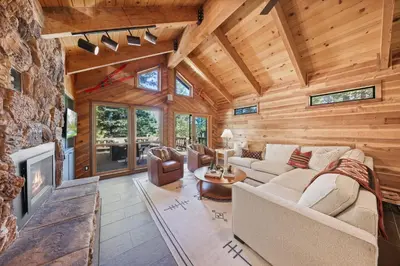a living room with a couch and a fireplace at Sleeping Bear Lodge- Remodeled 3BR Cabin- Fireplace- Ski Shuttle- Pet-Friendly in Truckee