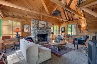 a living room with a fireplace in a cabin at Falcon's Rest - Ski and Summer Cabin in The Heart of North Lake Tahoe- Gas Fireplace in Carnelian Bay