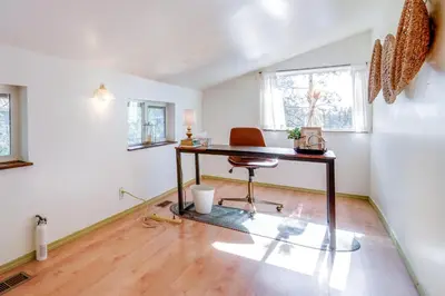 an office with a desk and a chair in a room at Serene Lakes Cabin with Deck Dog Friendly! in Soda Springs