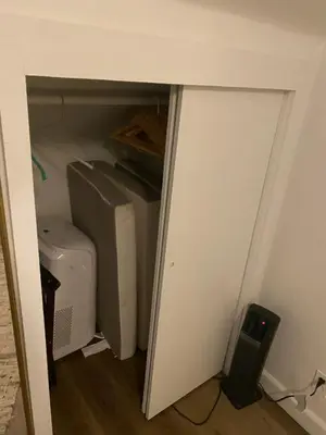 a door into a room with a computer and a printer at Midtown Flight Deck: 2BR Gem in Reno