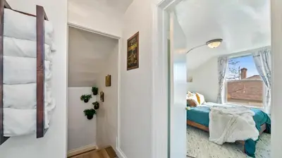 a bedroom with a bed and a window at Midtown Flight Deck: 2BR Gem in Reno
