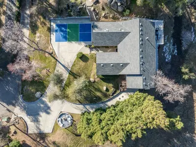 an overhead view of a building with a swimming pool at Yosemite Bass Lake VIEWS, 2 Homes, Games, Hot Tub in Coarsegold