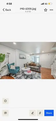 a living room with a couch and a table at Del Mar pool Home in Fresno
