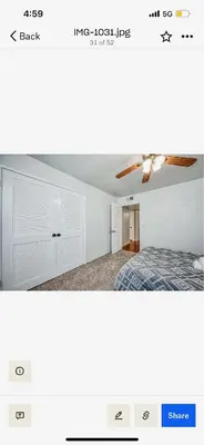 a bedroom with a bed and a ceiling at Del Mar pool Home in Fresno